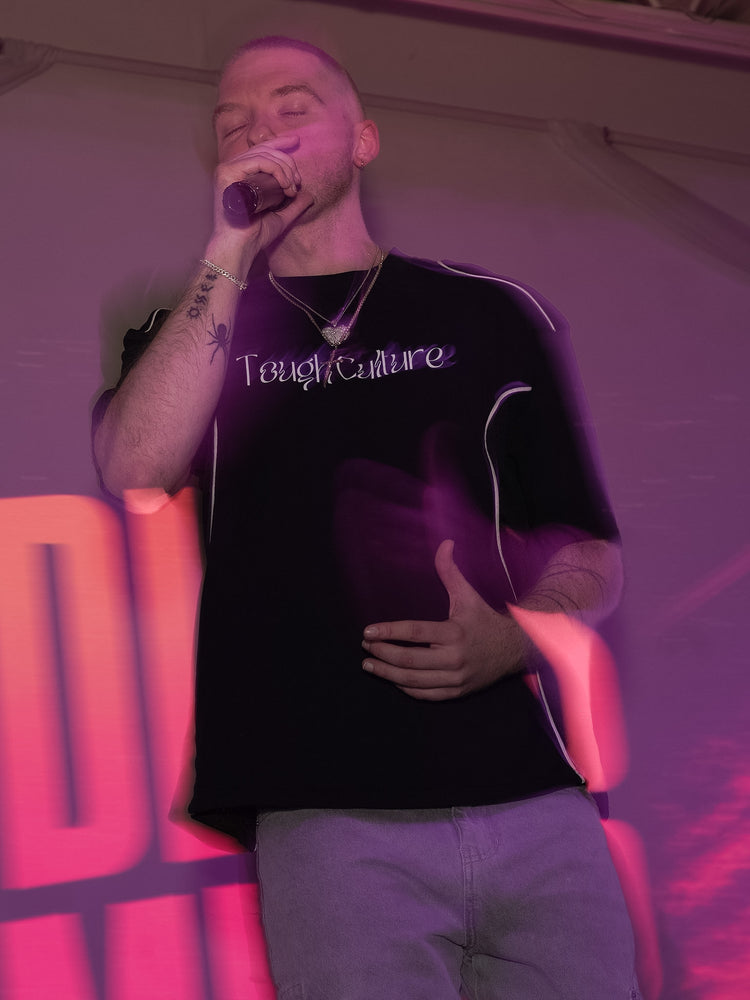 Performing live in the Tough Culture tee